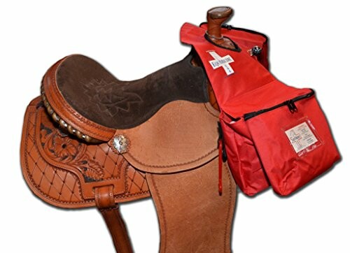 Leather horse saddle with red saddlebag attached.