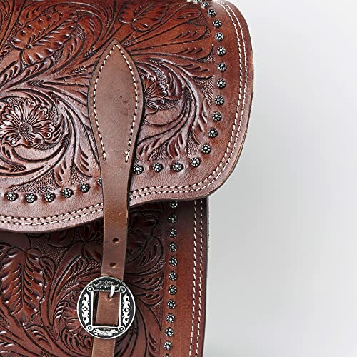 Close-up of embossed leather bag with intricate floral patterns and buckle.